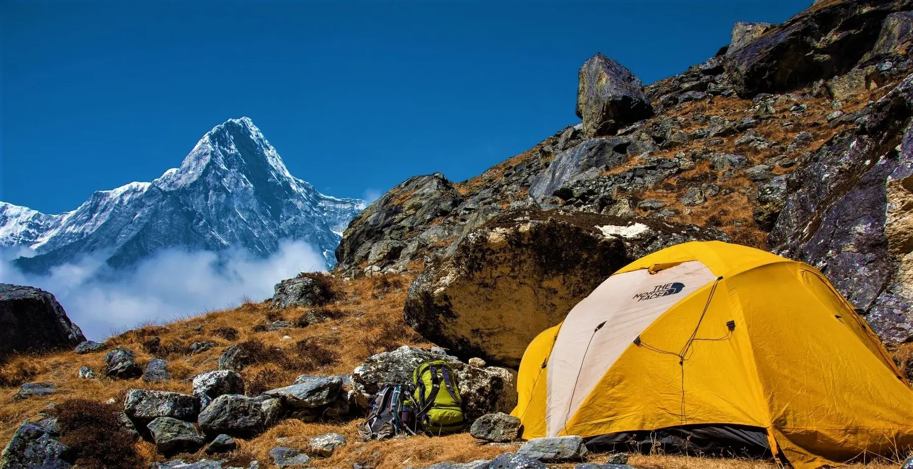 A mountain camp surrounded by Himalayan scenery